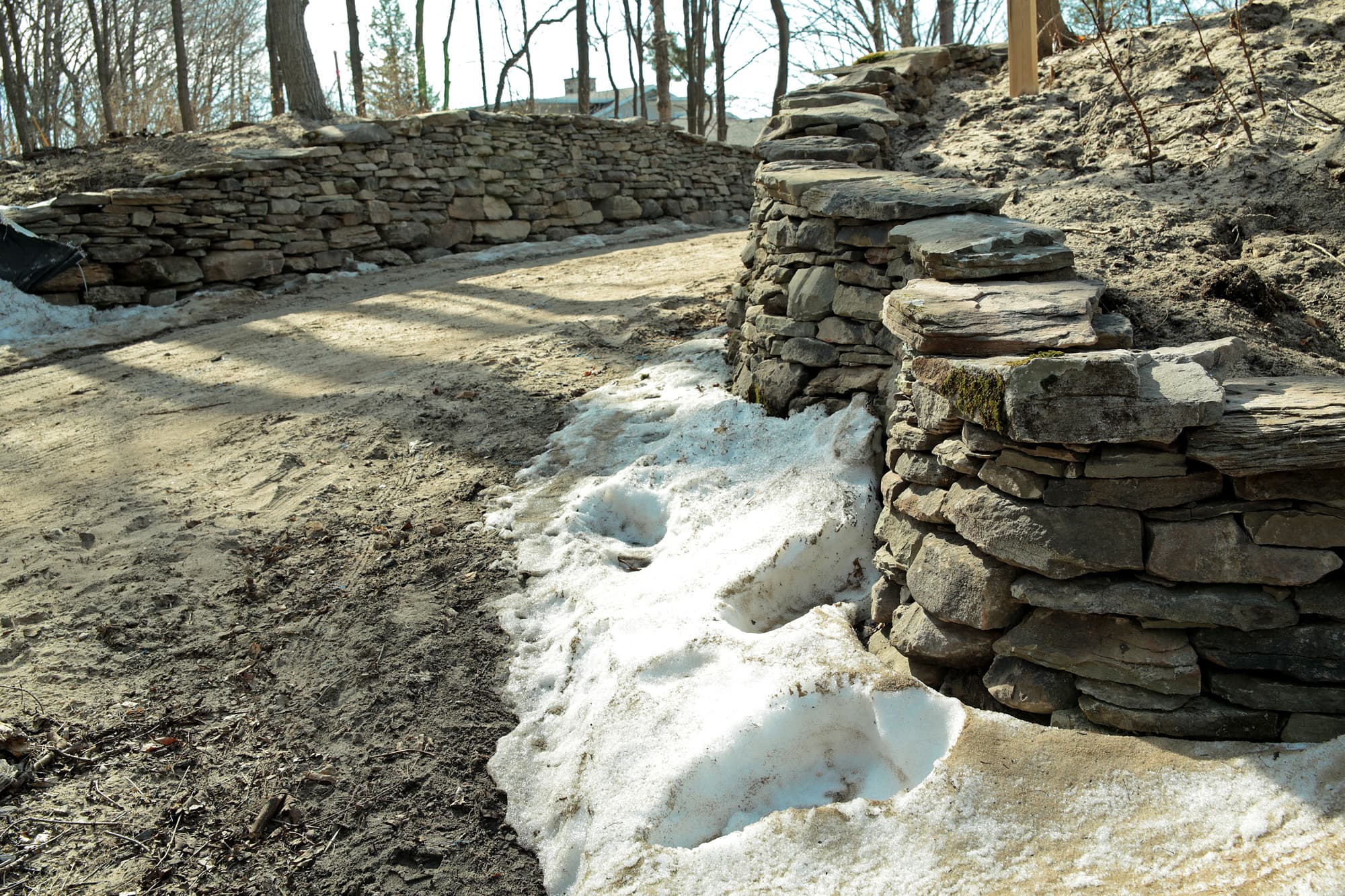 Close detail of a finished dry stone wall.