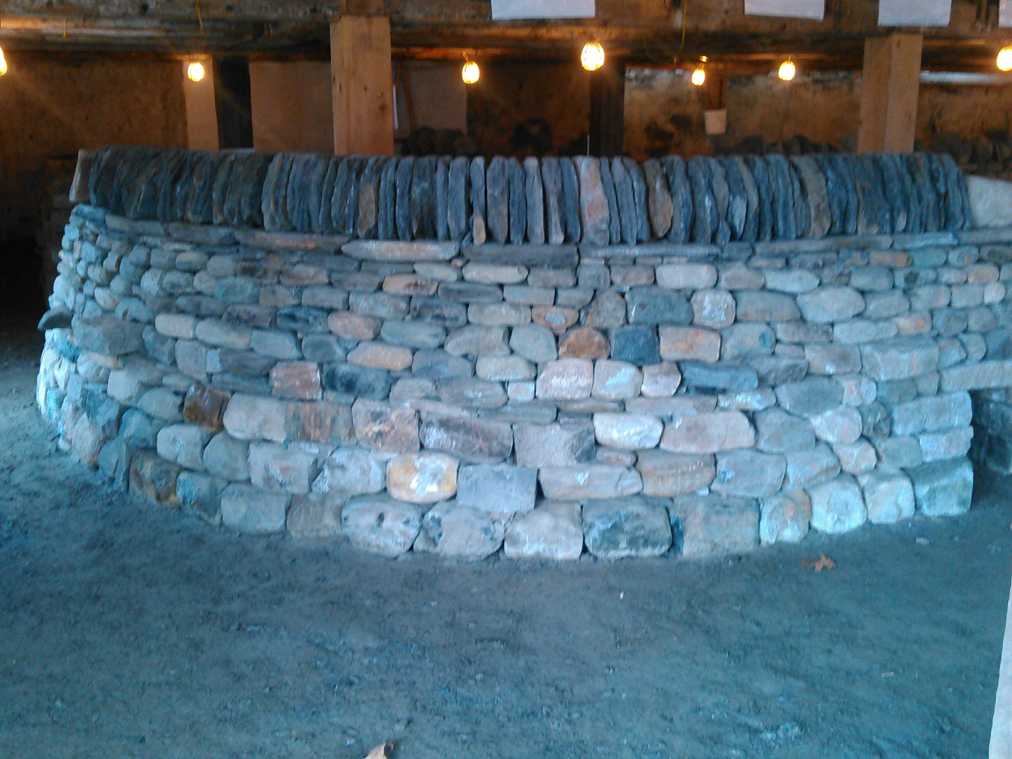 Flagstone patio and stone steps at a white house.