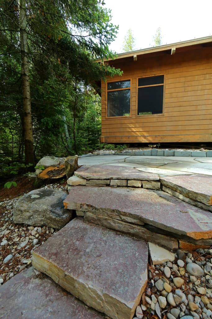 Large limestone slab platform set near the shoreline.