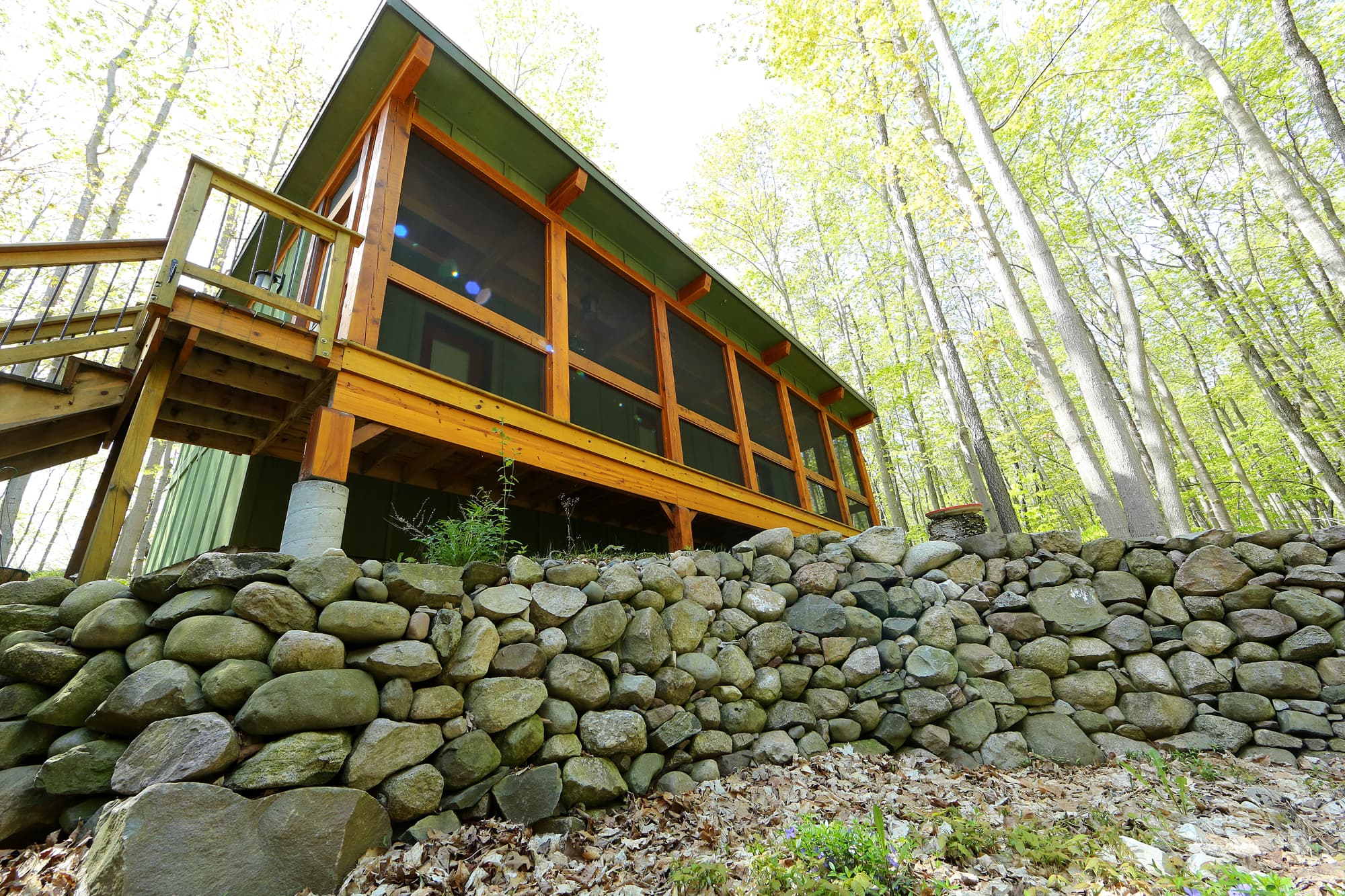 Long entrance view of a stone wall.