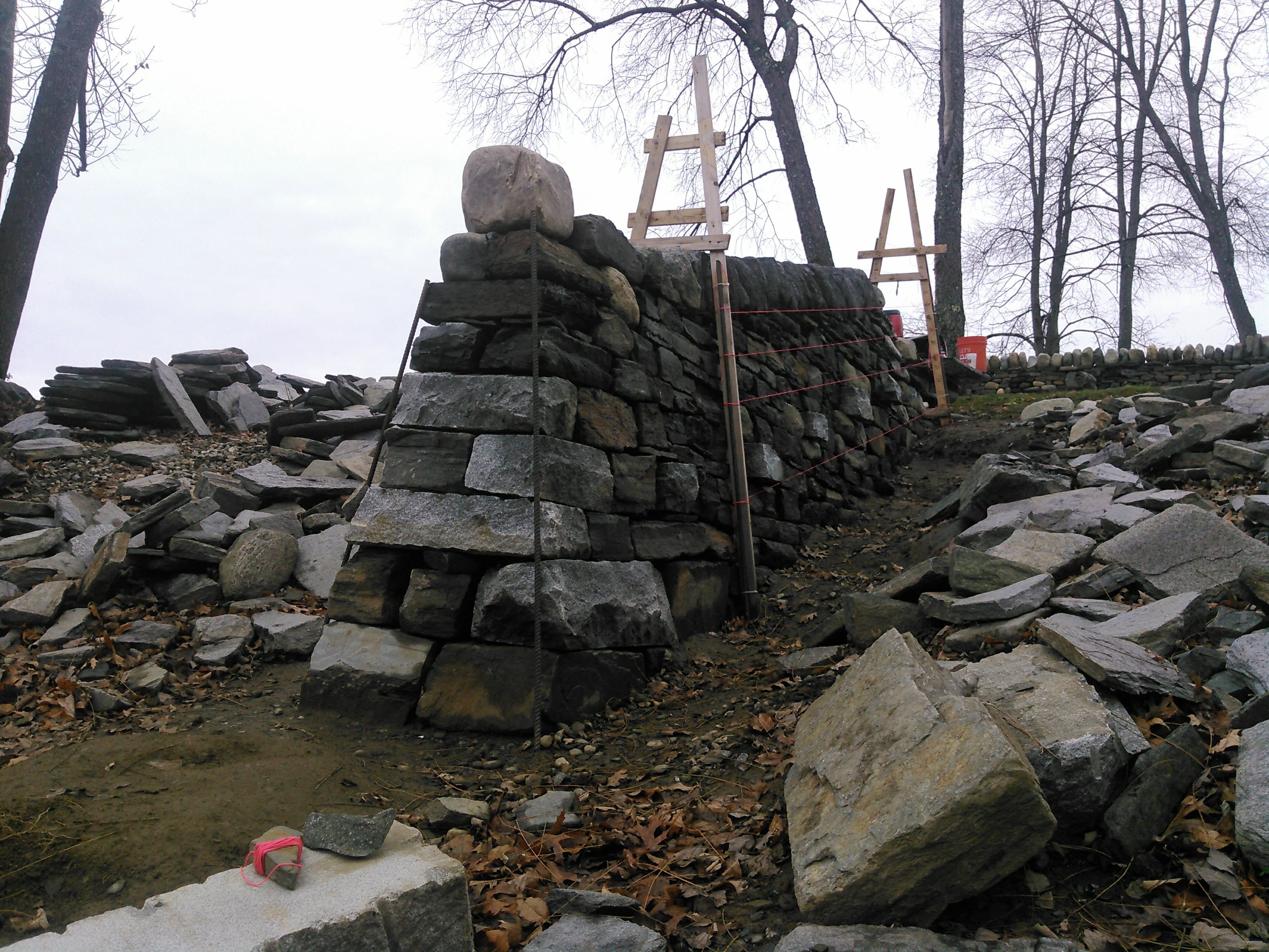 End of a dry stone wall under construction.